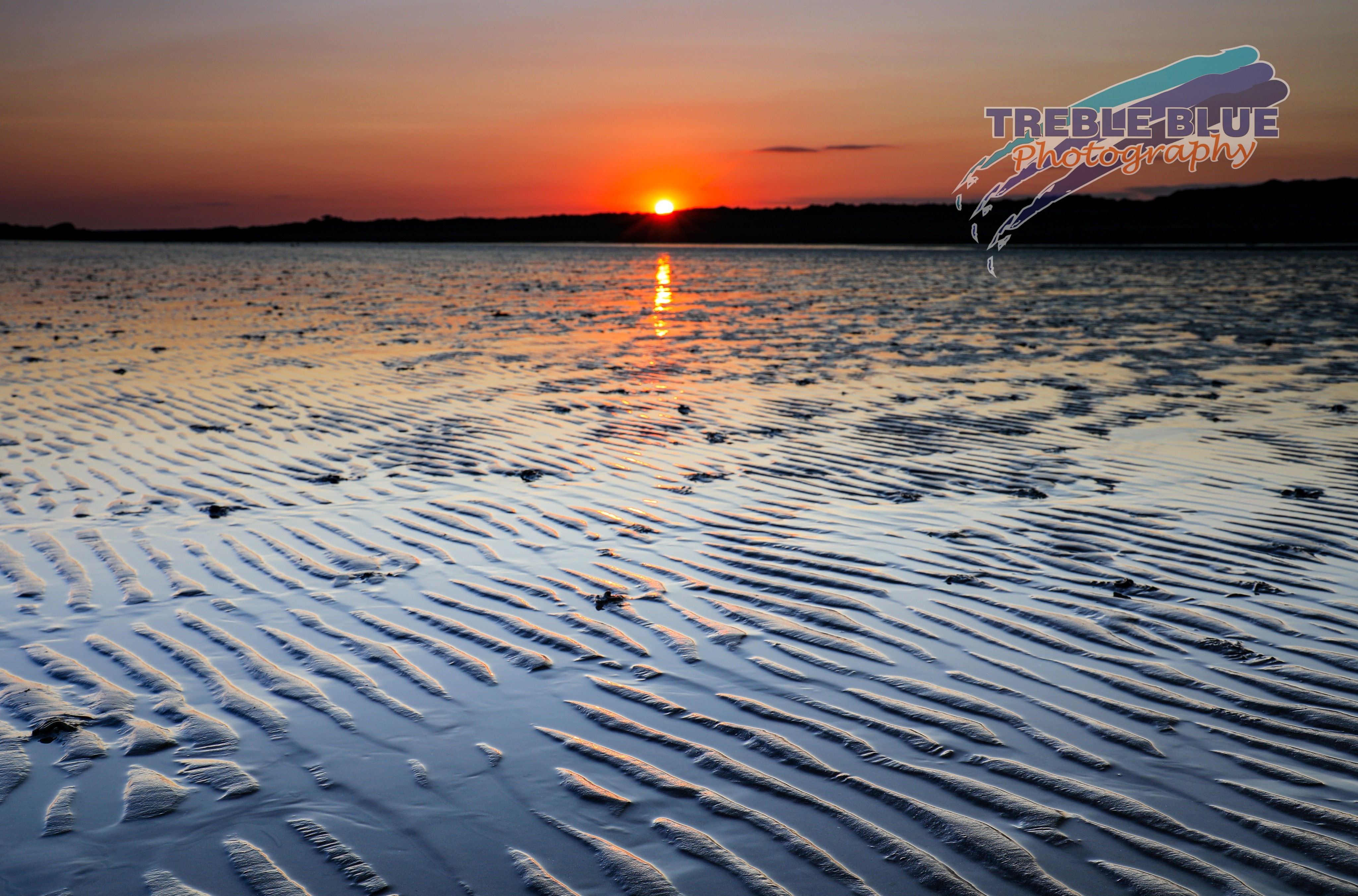 sunset on West Beach, Littlehampton at low tide, with the sand patterns exposed...